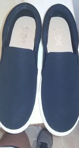 Brash black slip-on sneakers